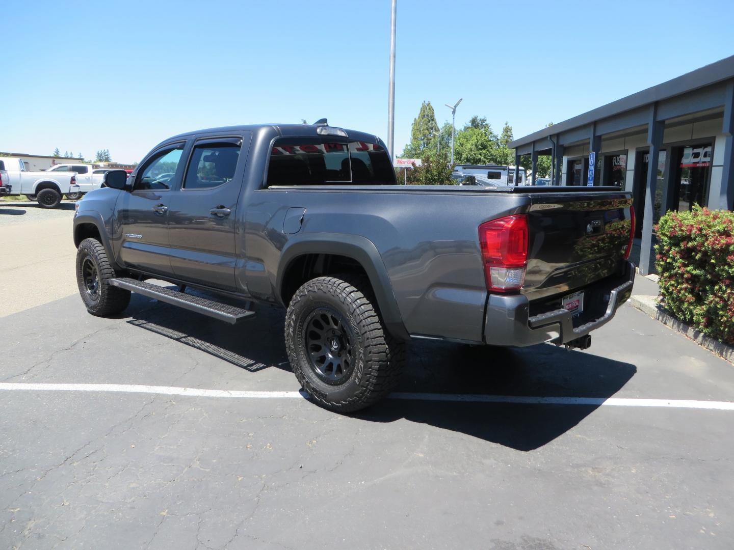 2017 CHARCOAL /GREY Toyota Tacoma TRD OFF-ROAD Double Cab Long Bed V6 6AT 4WD (3TMDZ5BN3HM) with an 3.5L V6 engine, automatic transmission, located at 2630 Grass Valley Highway, Auburn, CA, 95603, (530) 508-5100, 38.937893, -121.095482 - TRD Off-road Tacoma with a level kit, 17" Fuel Vector wheels, Falken Wildpeak AT tires, N-Fab running boards, Roll Up tonneau cover, BedRug, and window Deflectors. - Photo#6